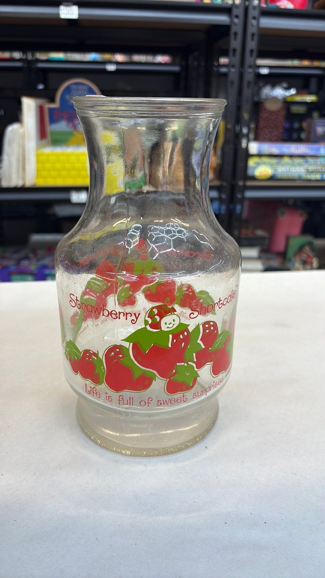 11B- Vintage Anchor Hocking Glass 1980 Strawberry Shortcake 52 oz. Carafe - needs cleaned