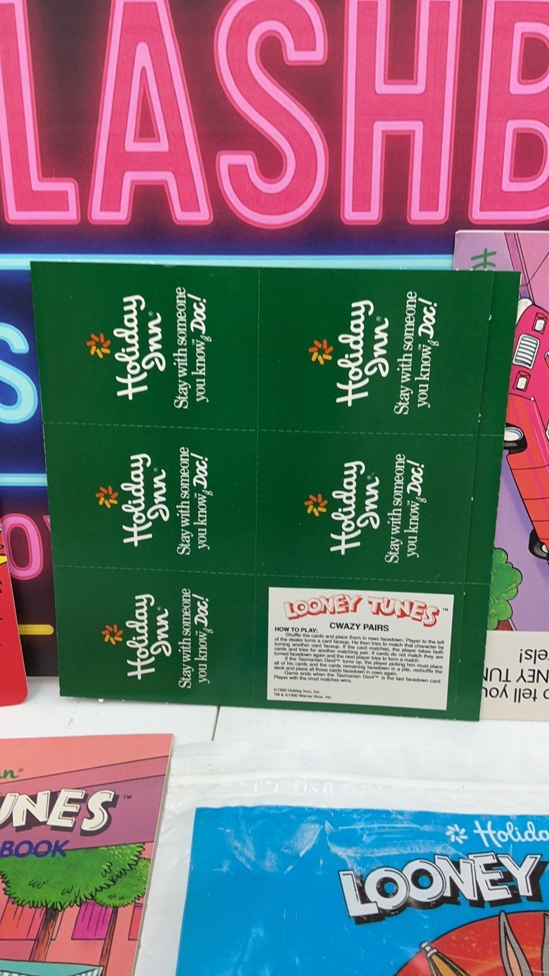 12B- 1990 Holiday Inn Looney Tunes vacation packet with card game, activity booklet, etc.
