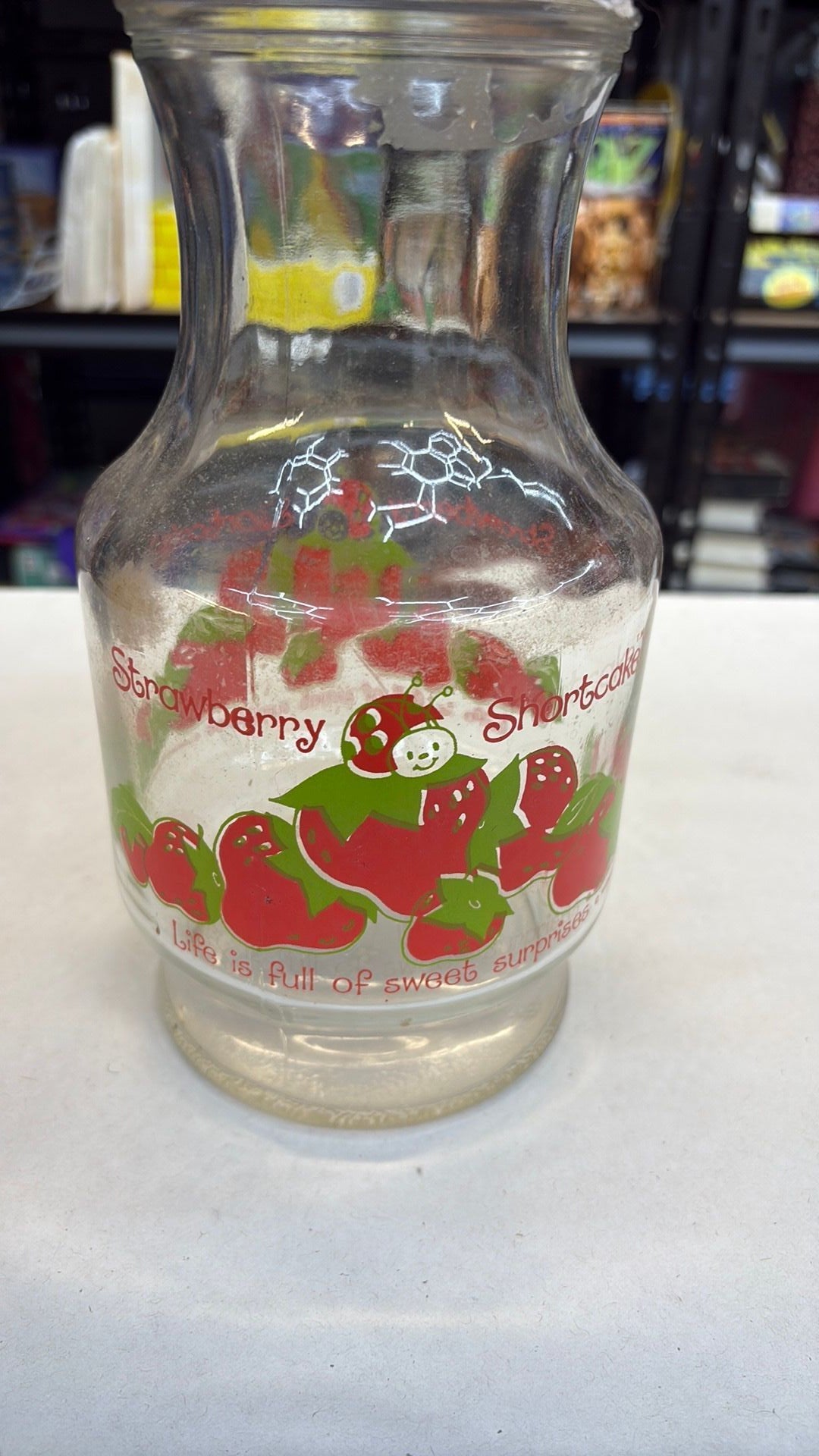 11B- Vintage Anchor Hocking Glass 1980 Strawberry Shortcake 52 oz. Carafe - needs cleaned