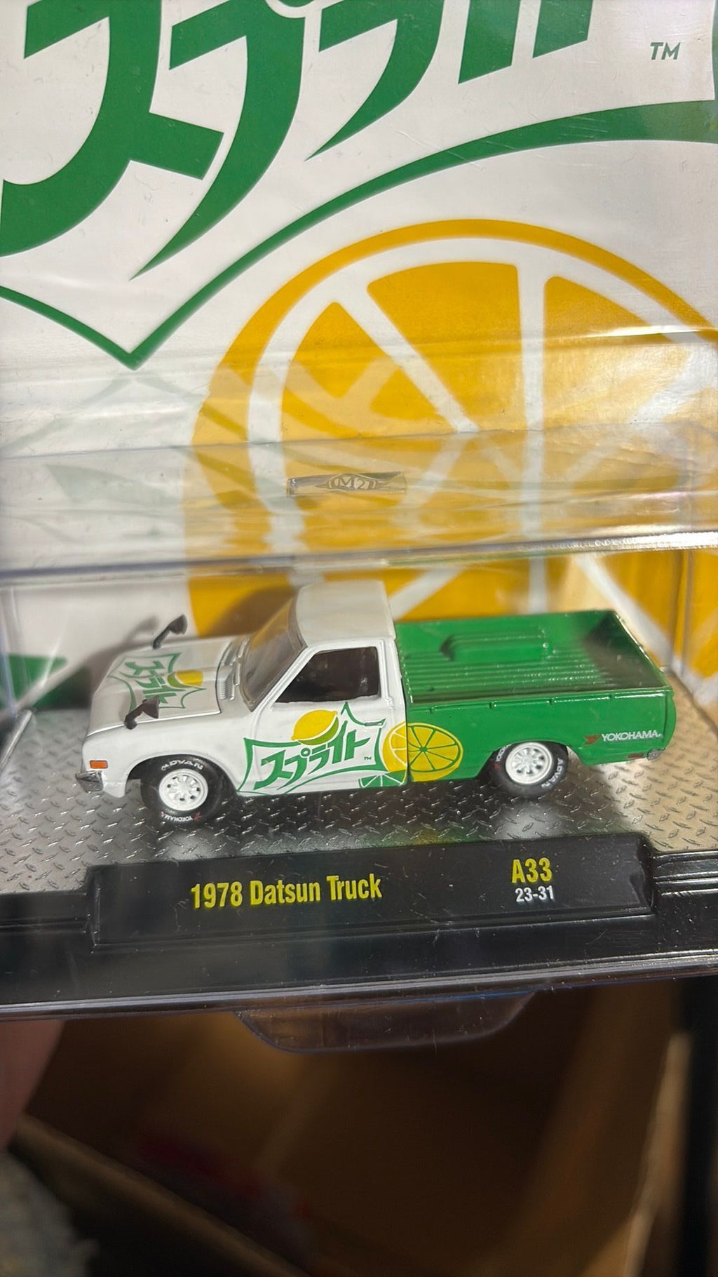 F. 2023 M2 Machines Coca Cola Japan's Sprite 1978 Datsun Truck